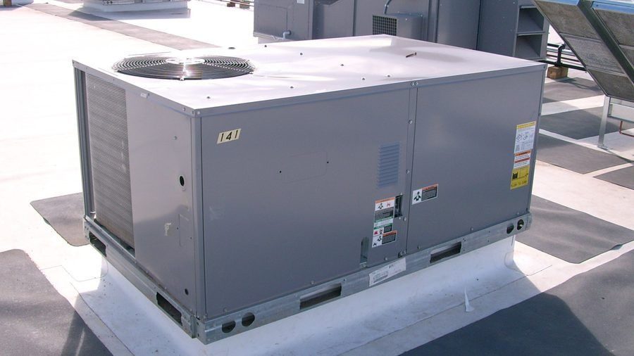 Commercial rooftop air conditioning unit for building cooling services.