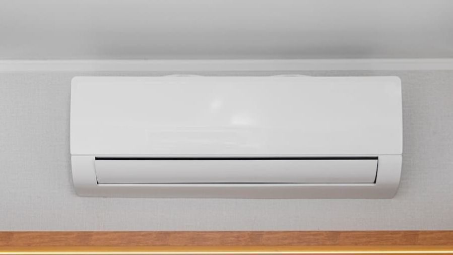 Ductless mini split installed into wall.